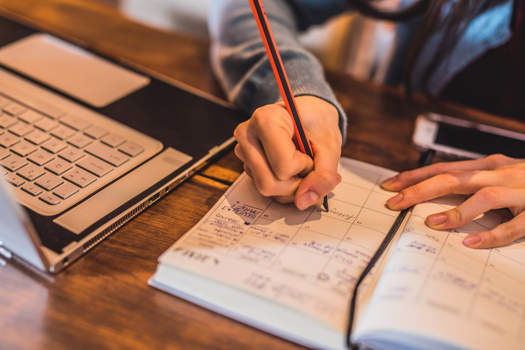 Midwife studying or completing her diary for day's work in clinic or community