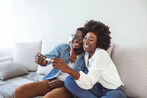  Joyful couple finding out pregnancy results  