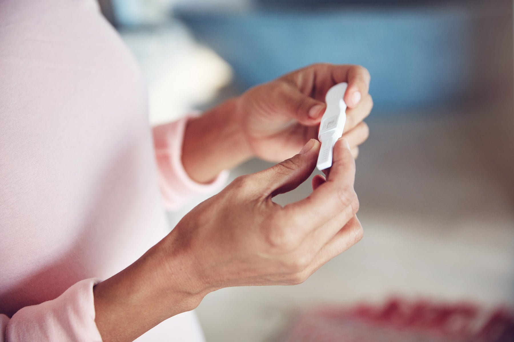 A woman completes an ovulation test to see if she is fertile.