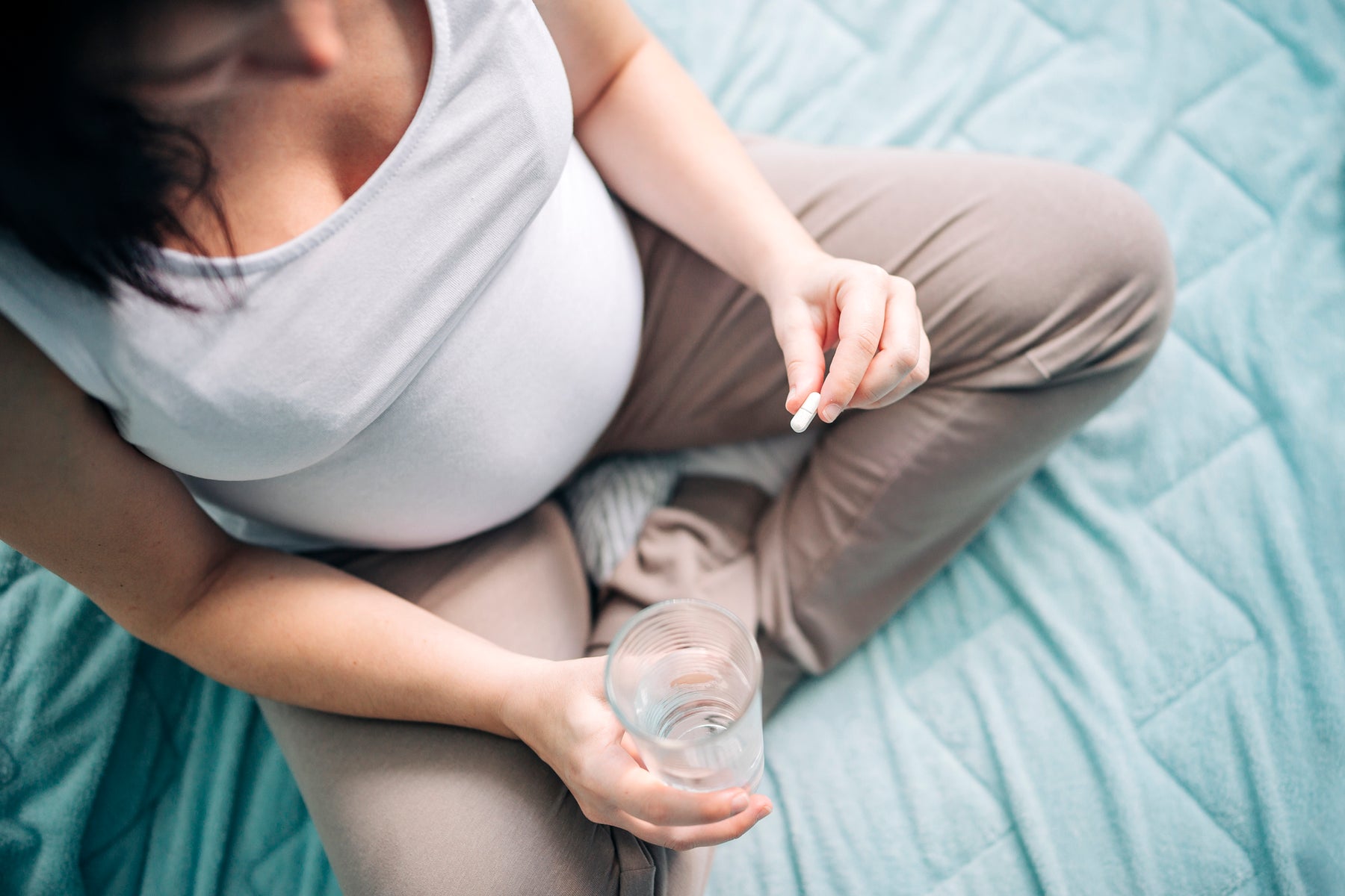Woman taking iron tablets during pregnancy