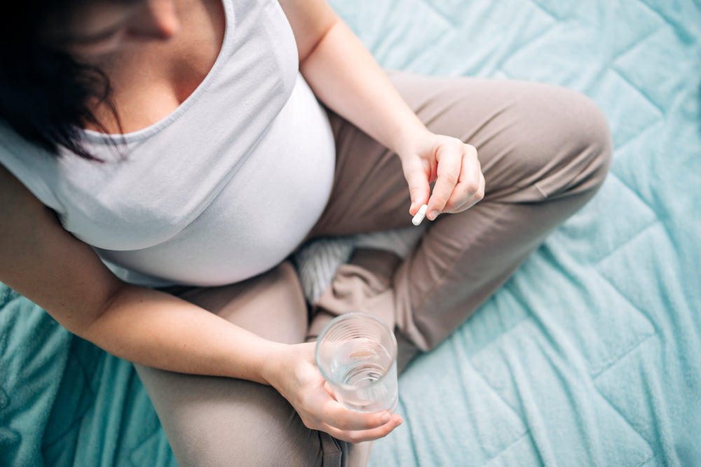  Woman taking iron tablets during pregnancy 